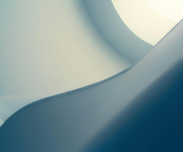 Sophisticated minimalist abstract with smooth blue curves and geometric design, perfect for a modern background.